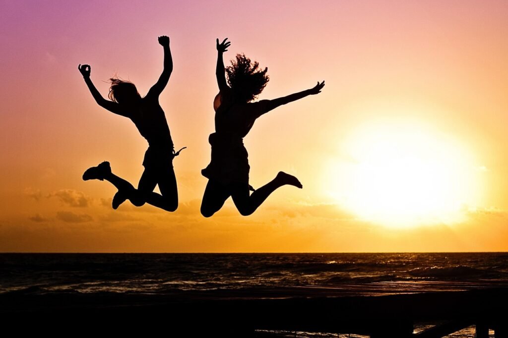 new year background, sunset, beach, silhouettes, jump, jumping, youth, active, nature, happy, pair, girls, young women, people, joy, freedom, seaside, dusk